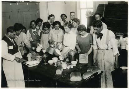 Men and women preparing a meal during a labor strike. Courtesy WVRHC.