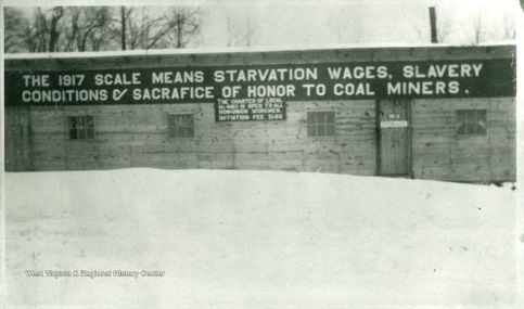 Barracks with a protest sign, Irona, West Virginia, circa 1917